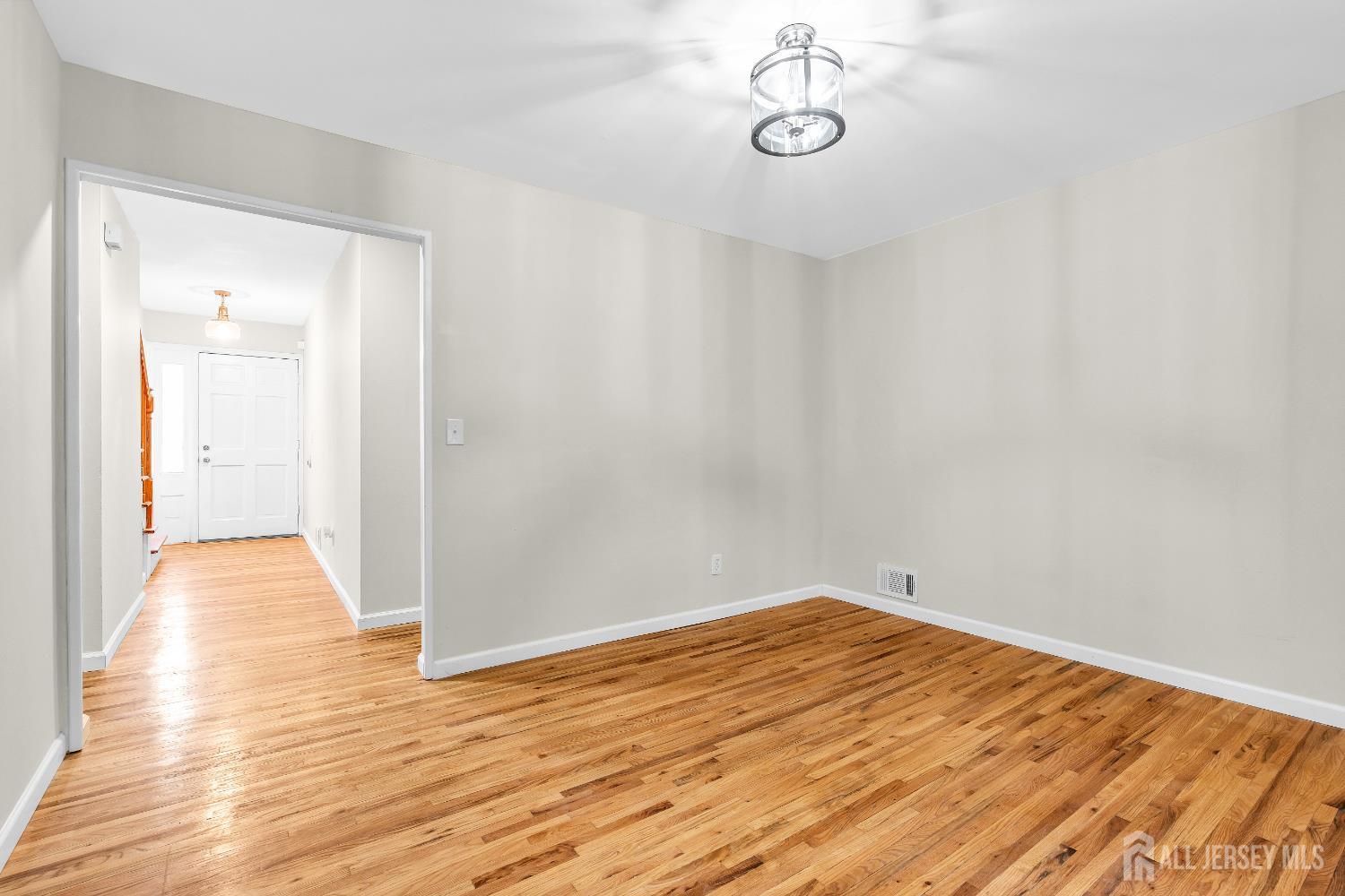 1322 Marcella Drive Union, NJ 07083 - Photo 8 of 48 a view of a room with wooden floor and white walls