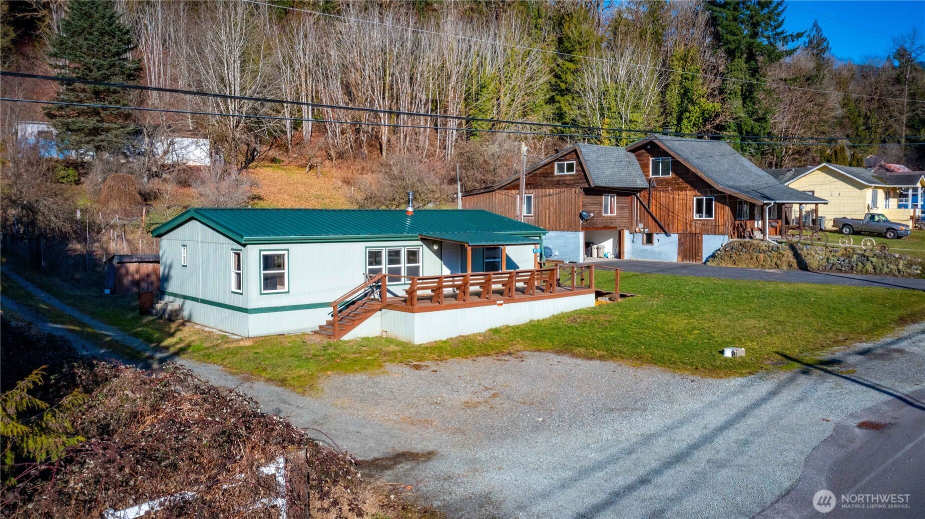 a view of a house with a yard and sitting area