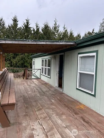 an empty room with a empty space and windows