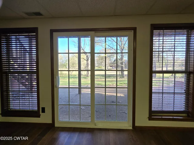 a view of a room that has a large window