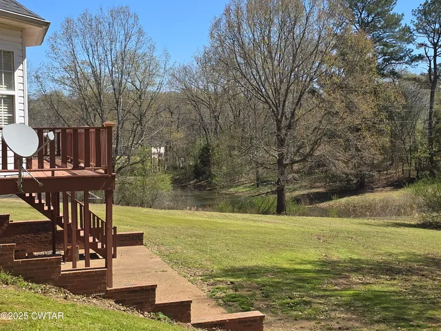a view of a swimming pool with an outdoor seating