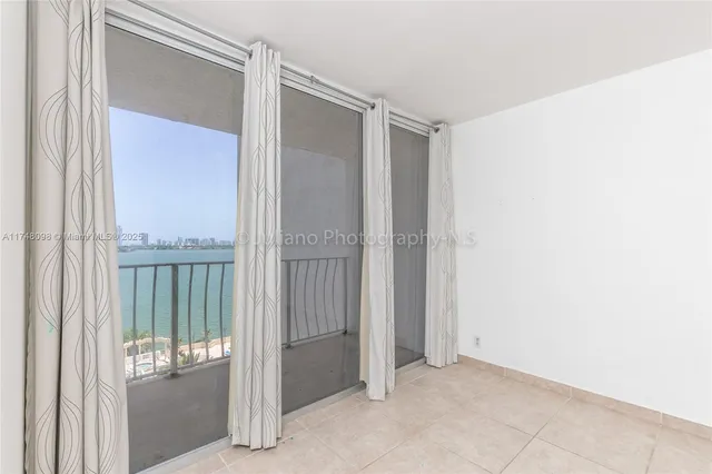 a kitchen with a refrigerator sink and cabinets