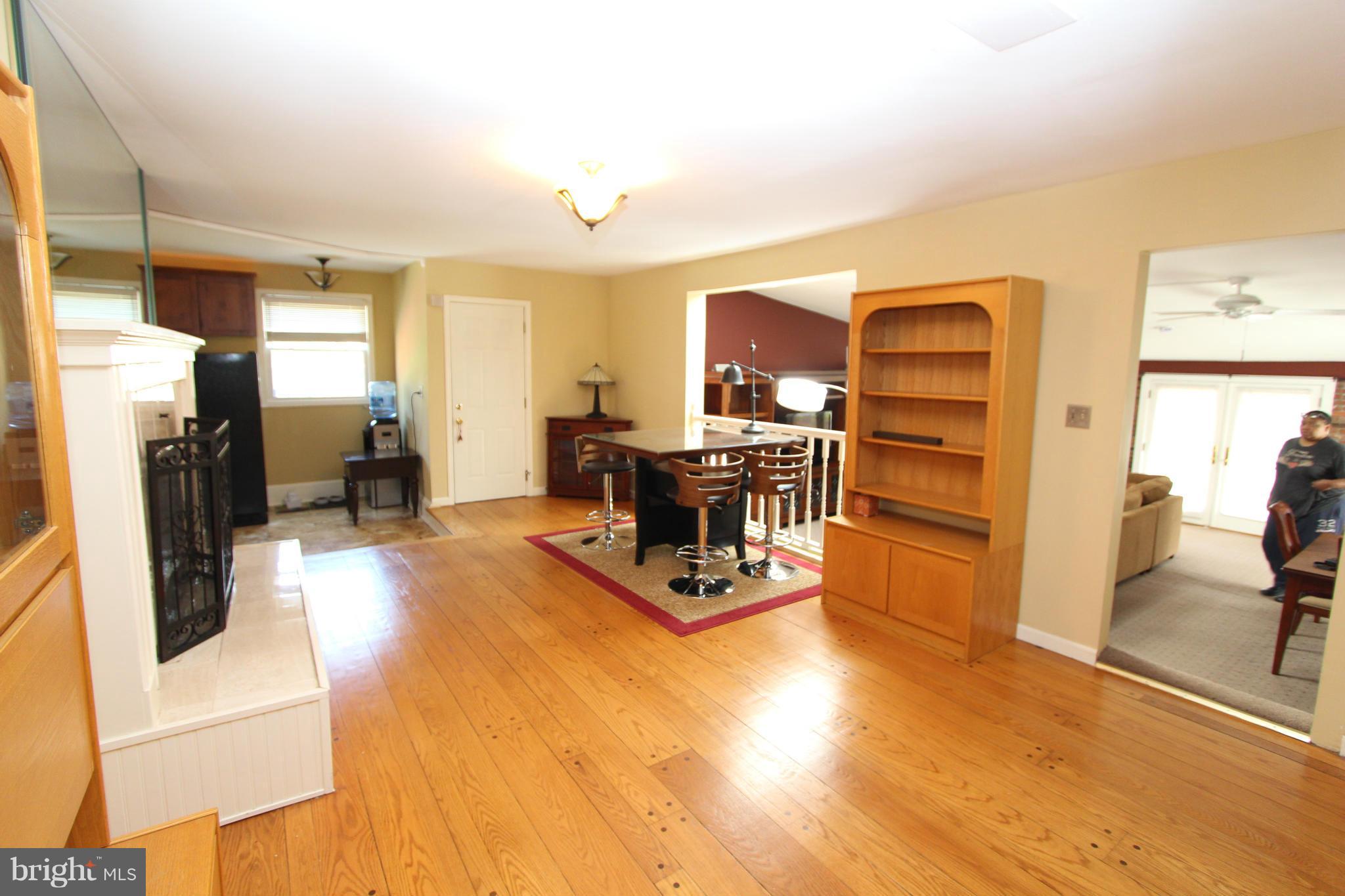8720 Windsor Mill Road Baltimore, MD 21244 - Photo 11 of 27 a living room with furniture and a flat screen tv