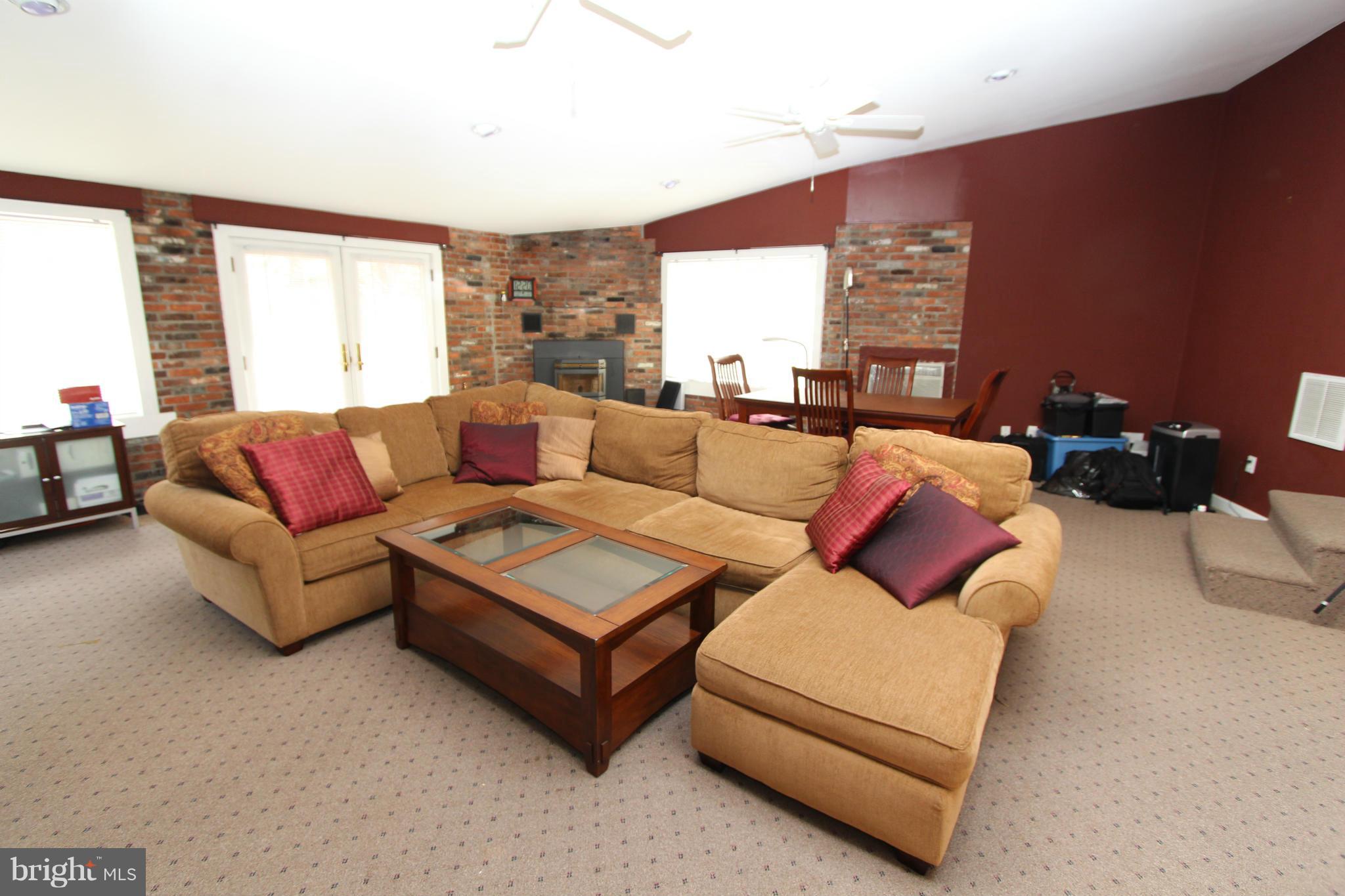8720 Windsor Mill Road Baltimore, MD 21244 - Photo 12 of 27 a living room with furniture and a large window