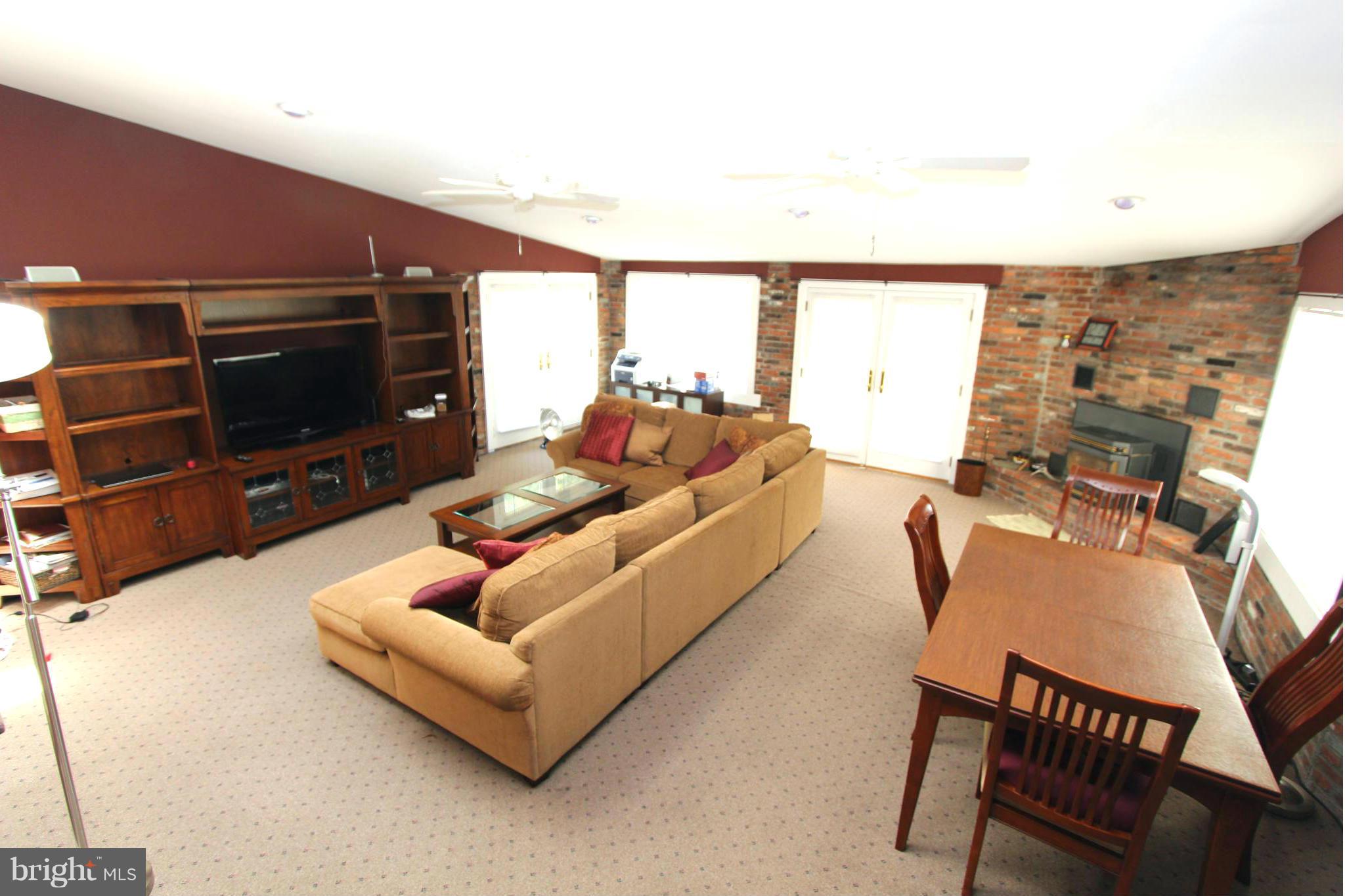 8720 Windsor Mill Road Baltimore, MD 21244 - Photo 13 of 27 a living room with furniture and a flat screen tv