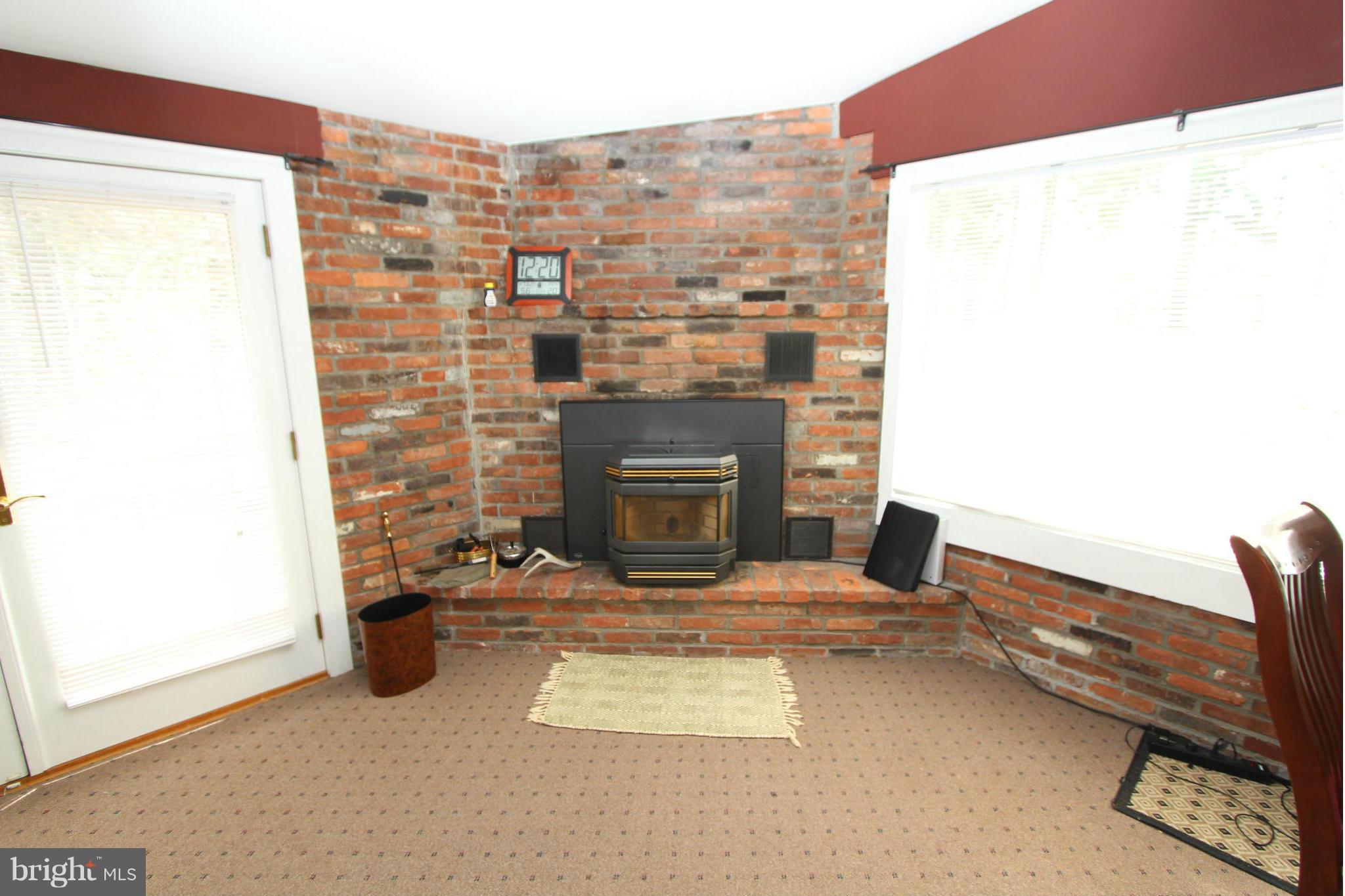 8720 Windsor Mill Road Baltimore, MD 21244 - Photo 15 of 27 a view of an empty room with a fireplace