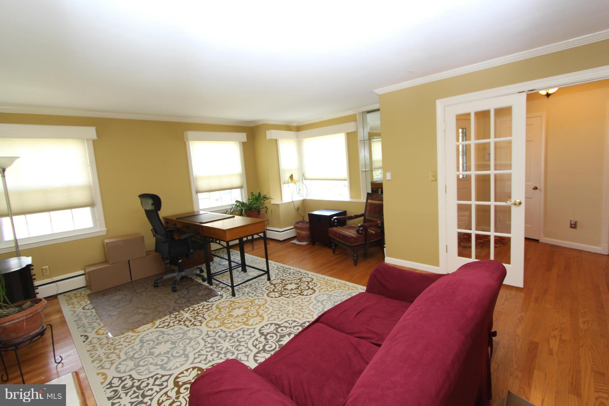 8720 Windsor Mill Road Baltimore, MD 21244 - Photo 20 of 27 a living room with furniture and a window