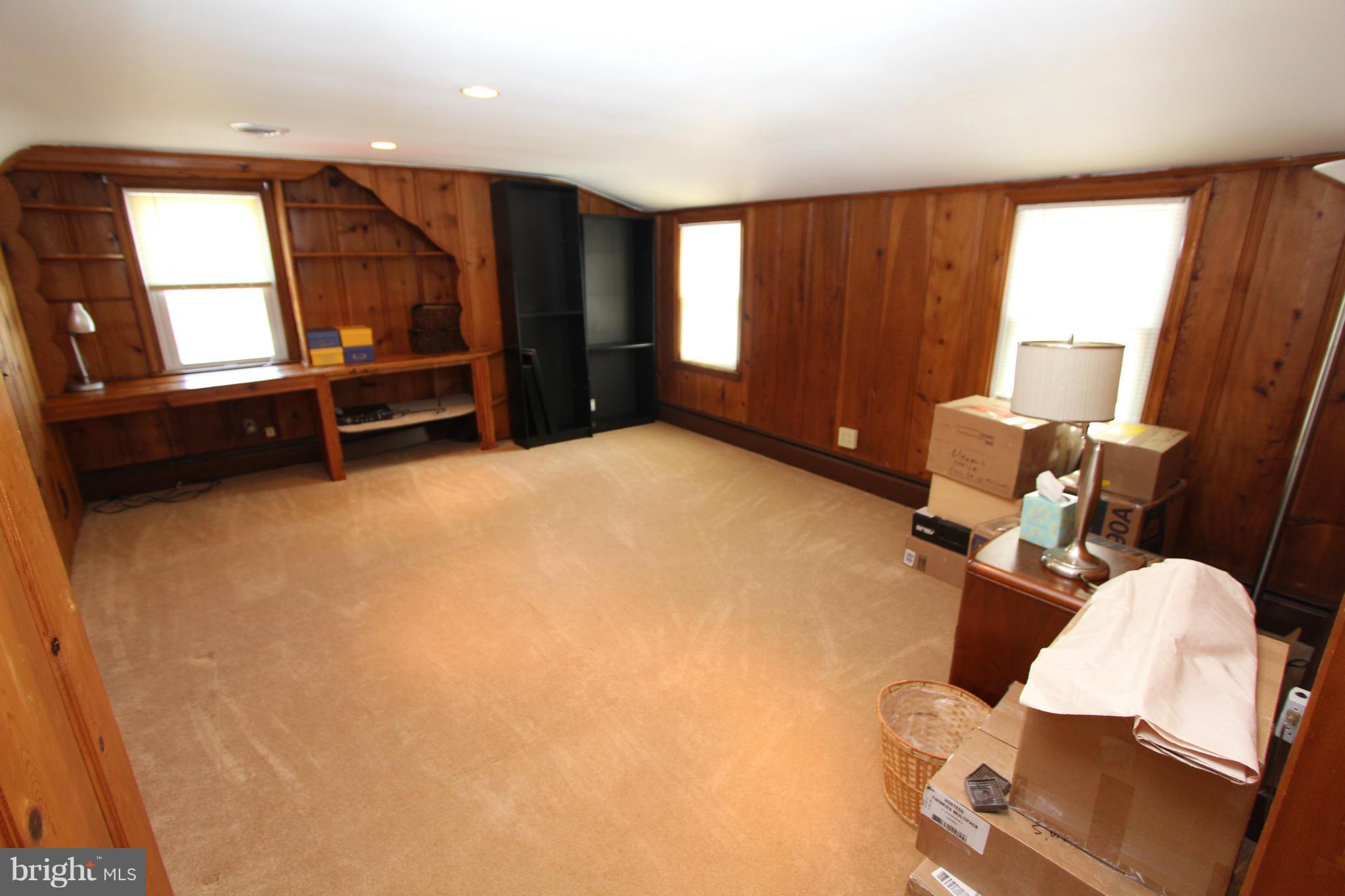 8720 Windsor Mill Road Baltimore, MD 21244 - Photo 23 of 27 a room with furniture and window