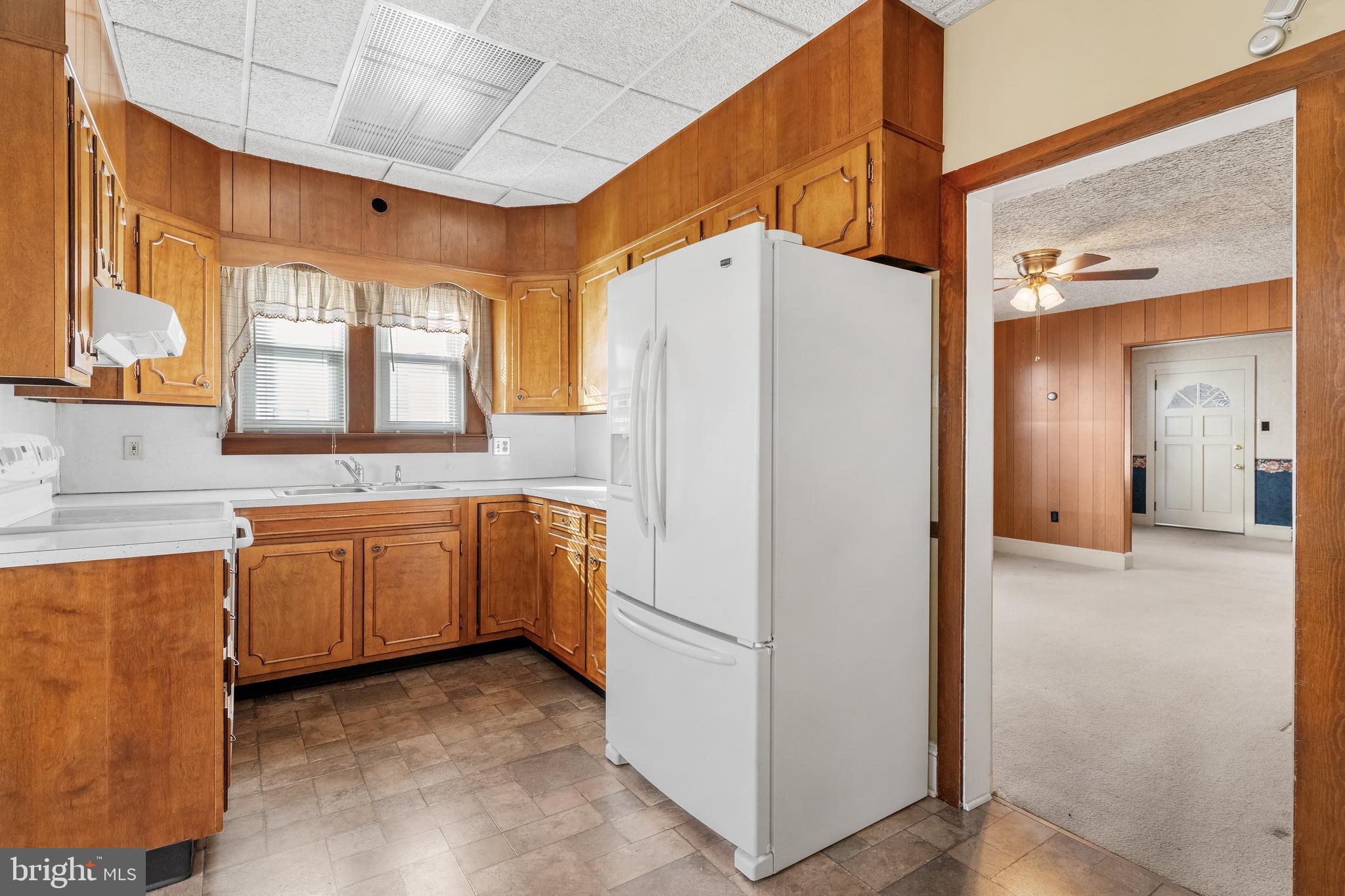 29 South 6th Street Quakertown, PA 18951 - Photo 16 of 51 a white refrigerator freezer sitting inside of a kitchen