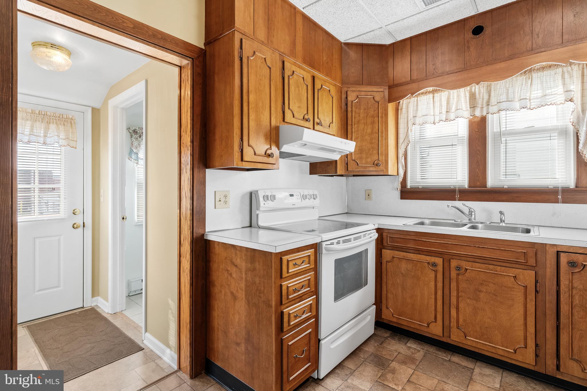 29 South 6th Street Quakertown, PA 18951 - Photo 21 of 51 a kitchen with a sink stove and cabinets