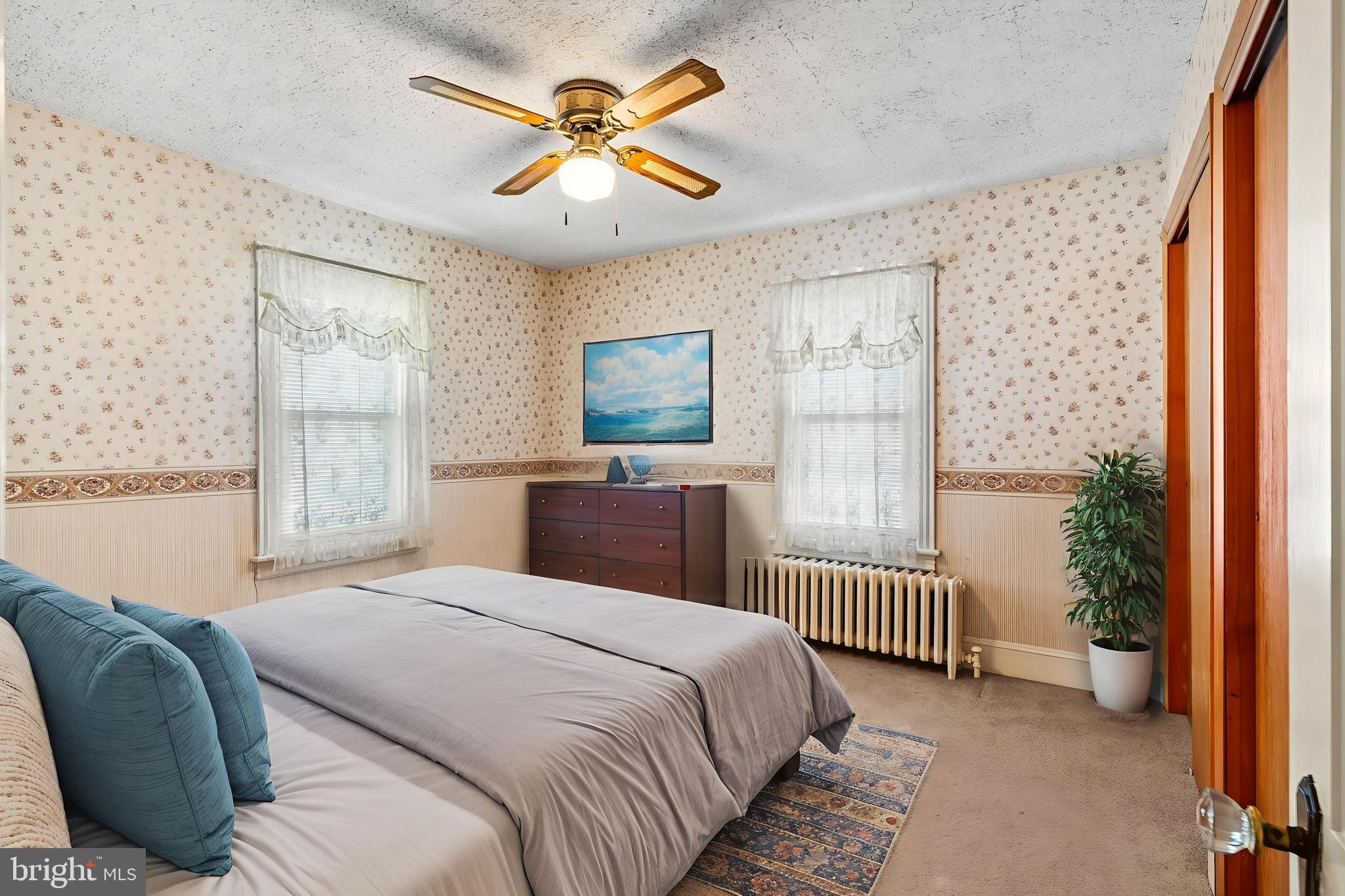 29 South 6th Street Quakertown, PA 18951 - Photo 27 of 51 a bedroom with a bed and a large window