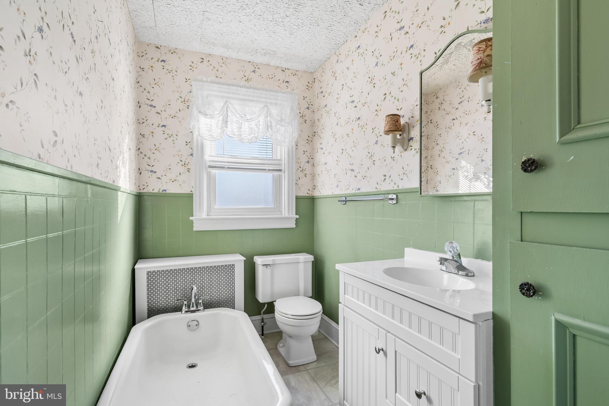 29 South 6th Street Quakertown, PA 18951 - Photo 32 of 51 a bathroom with a sink a toilet and mirror