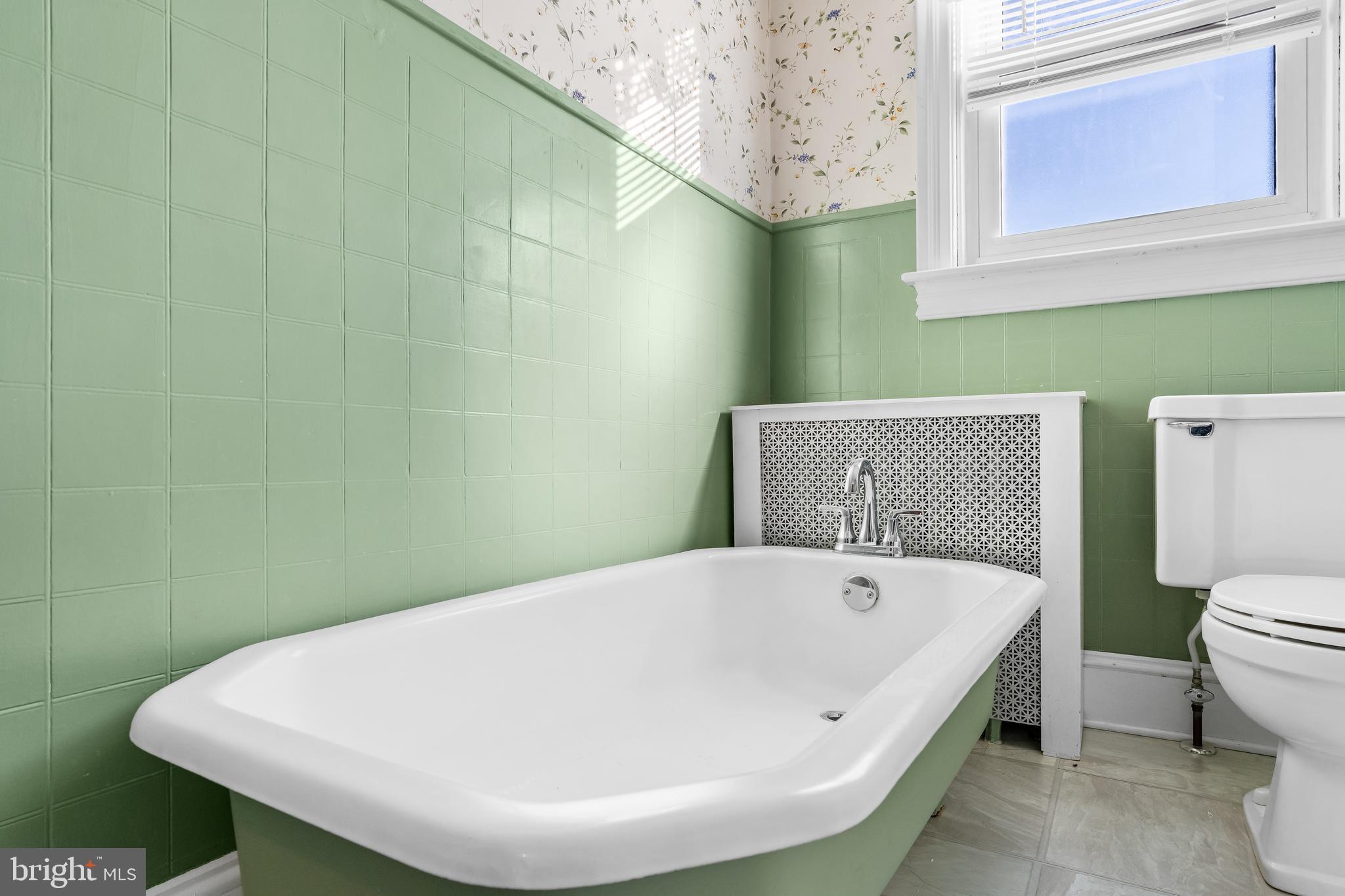 29 South 6th Street Quakertown, PA 18951 - Photo 33 of 51 a bathroom with a white bath tub and a toilet