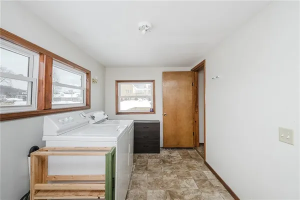 a view of a kitchen cabinets and a window