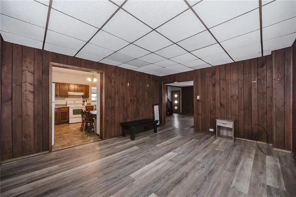 a view of a room with wooden floor and natural light