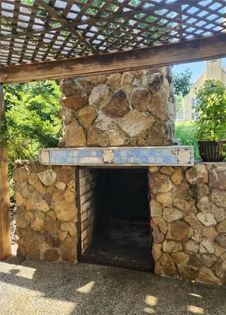 a view of a backyard with sitting area