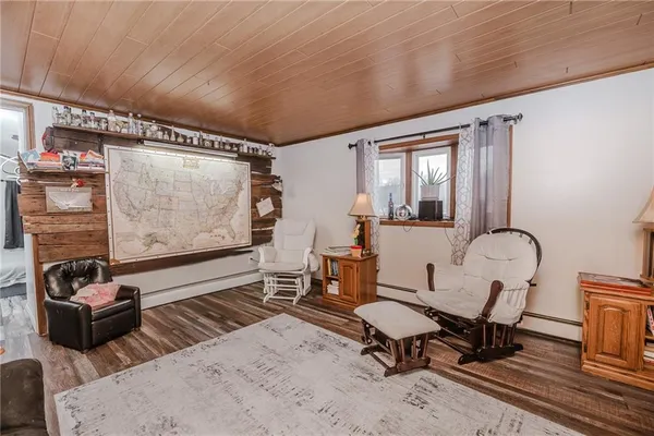 a living room with furniture a rug and a window