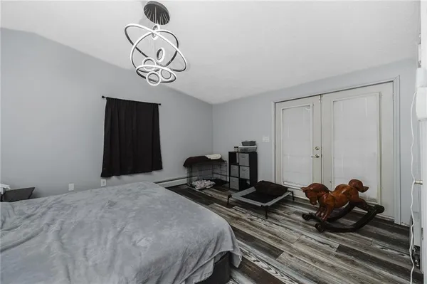 a bedroom with bed and a window