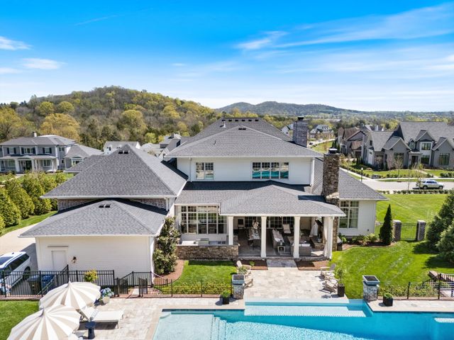 a view of a chairs and table in the patio