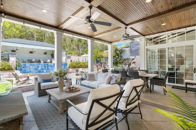 a view of a field with a tree in the background