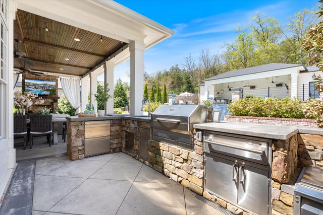a view of an entryway with a flower pot and a front door