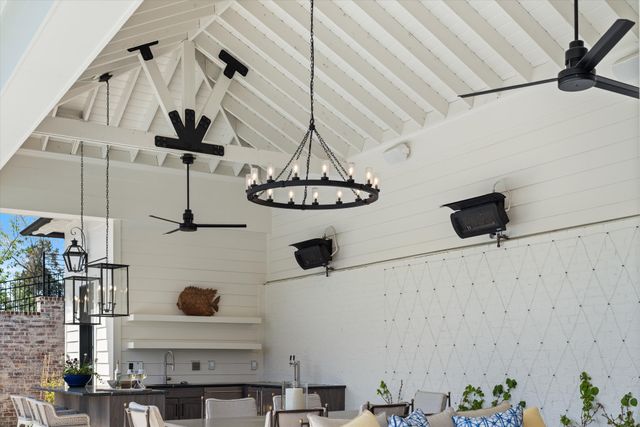 a living room with furniture fireplace and a large window
