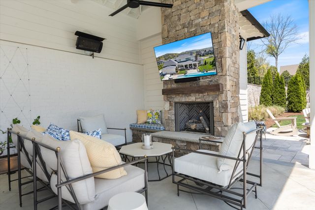 a kitchen with center island table and chairs in it