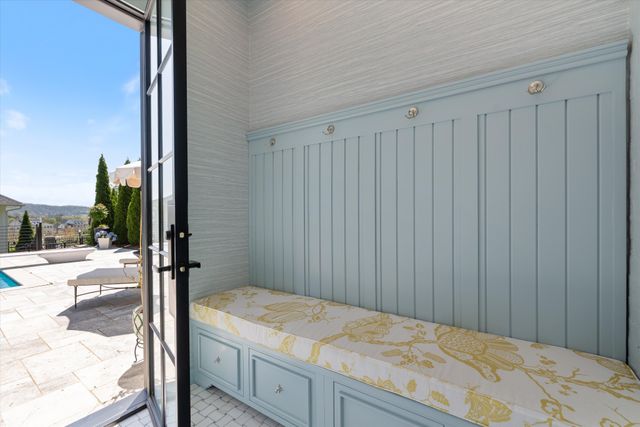 a bathroom with a shower and a glass door