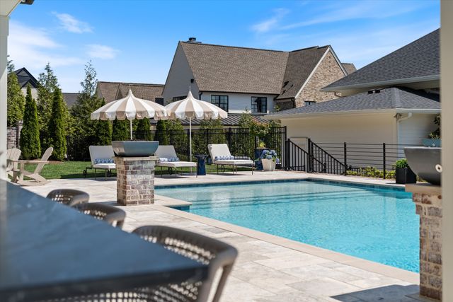 a white bath tub sitting in a bathroom next to a window