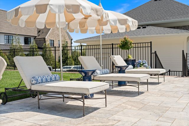 a en suite bathroom with a double vanity sink a large mirror and shower