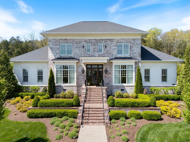 a view of a brick house with a large windows