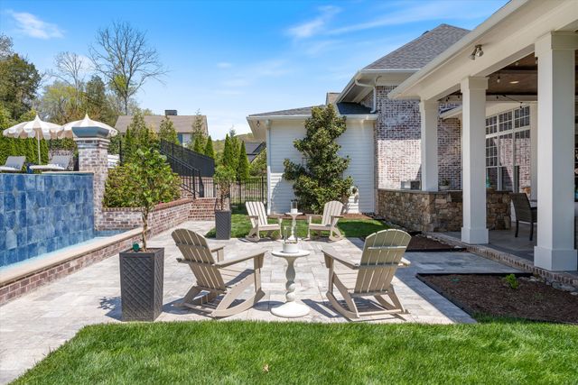 a bathroom with a granite countertop sink a toilet and bathtub