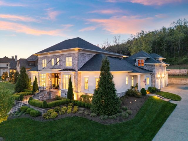 a view of a dining room with furniture and potted plant