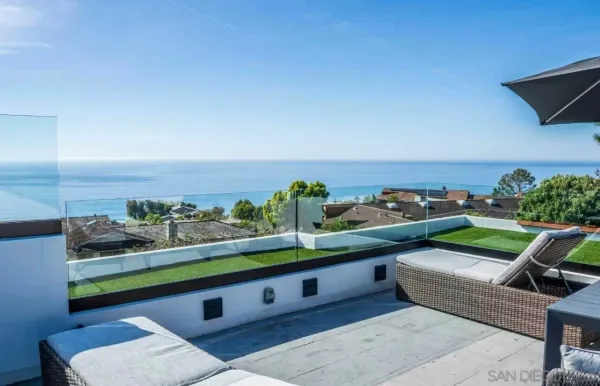 a view of a chairs and table in a patio