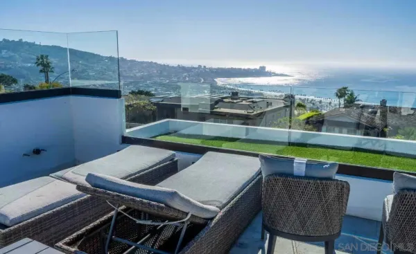 a view of a chairs and table in a terrace