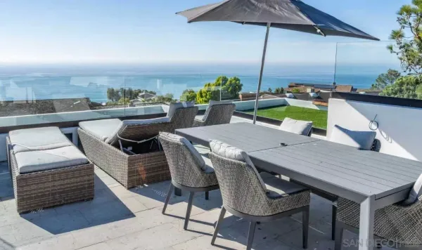 a view of an outside dining space with furniture