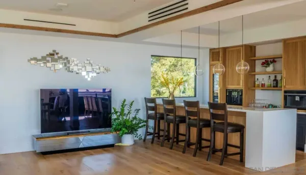 a living room with furniture dining table and a window