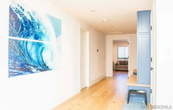 a en suite bathroom with a granite countertop sink and a mirror