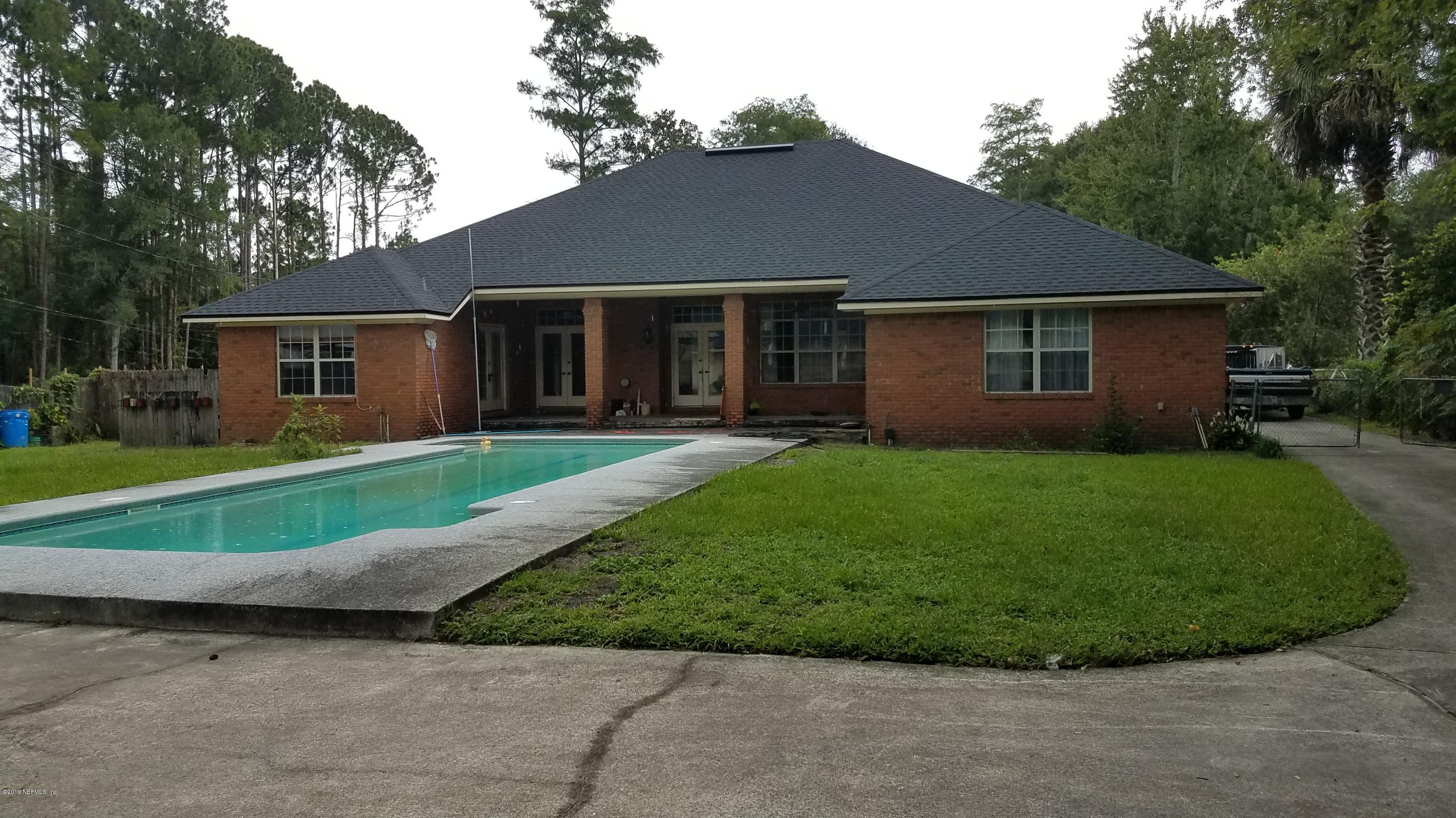 2970 Cortez Road Jacksonville, FL 32246 - Photo 3 of 12 a view of a house with a yard and large tree