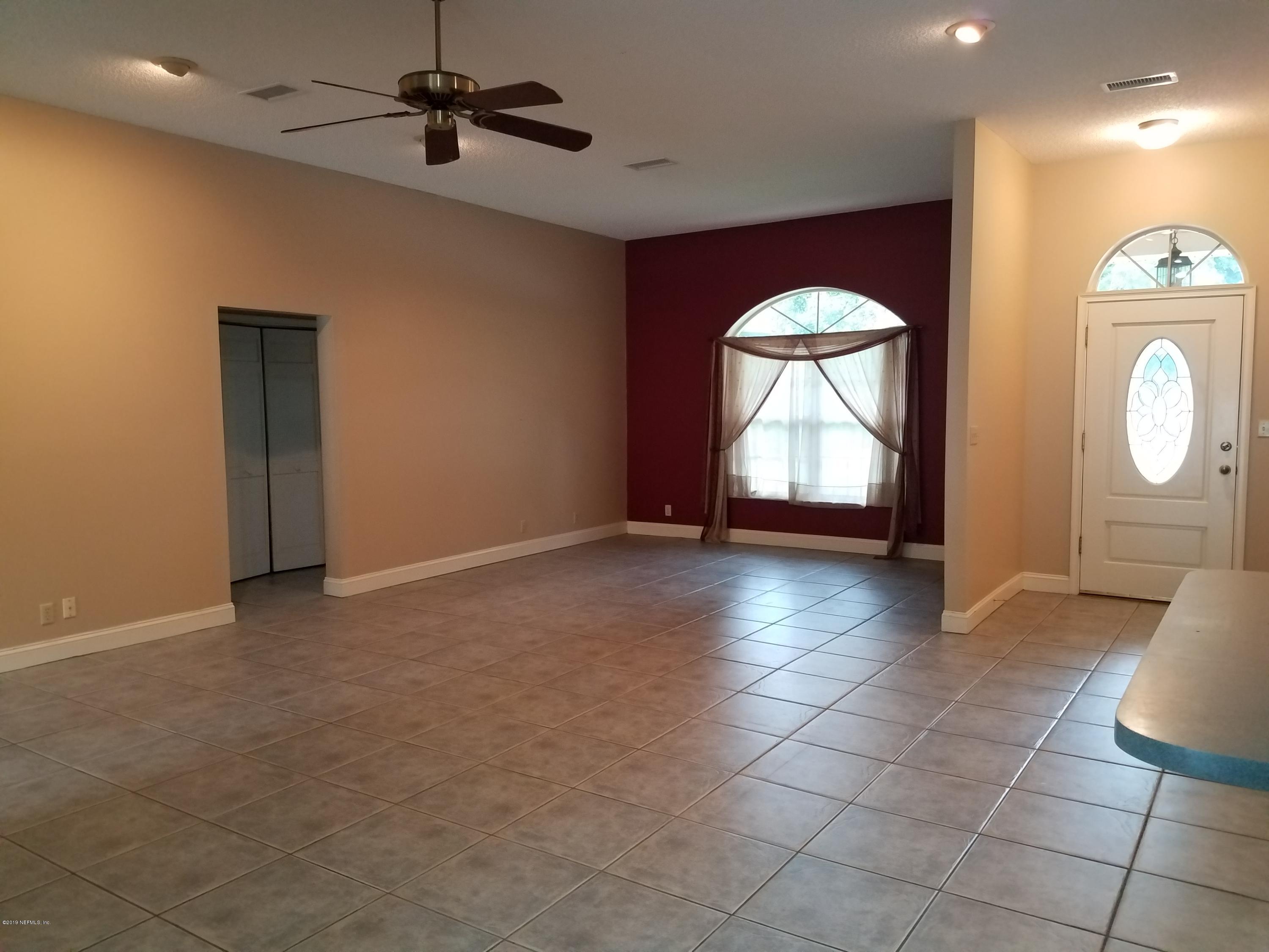2970 Cortez Road Jacksonville, FL 32246 - Photo 6 of 12 a view of a livingroom with a furniture chandelier and a window