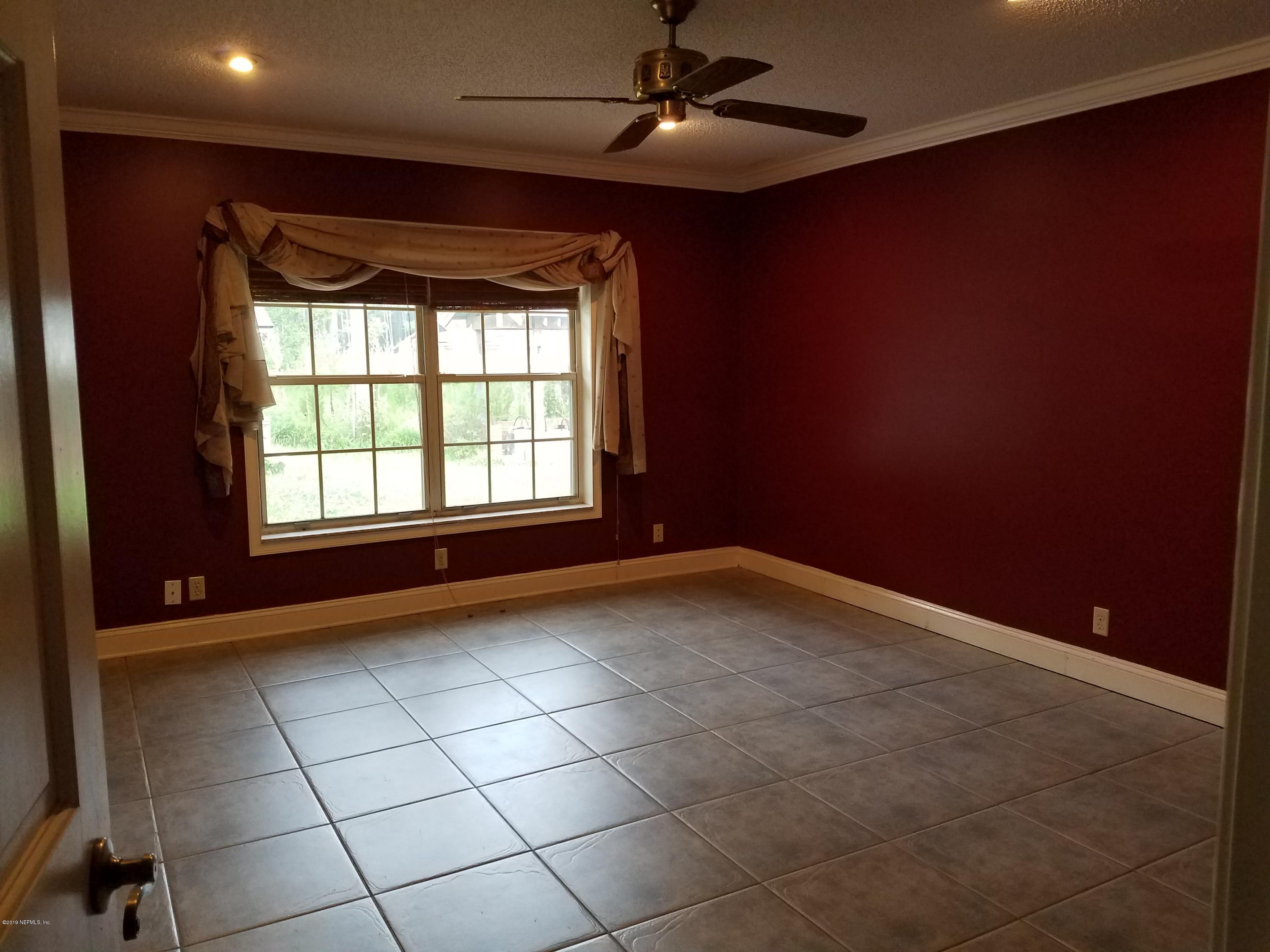 2970 Cortez Road Jacksonville, FL 32246 - Photo 10 of 12 a view of an empty room with a window