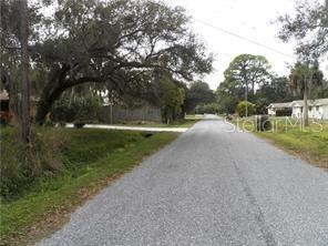 Geneva Road Venice, FL 34293 - Photo 3 of 3 a view of a road with a yard