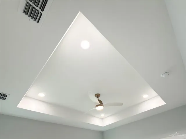 a bathroom with a granite countertop sink a large mirror and a shower