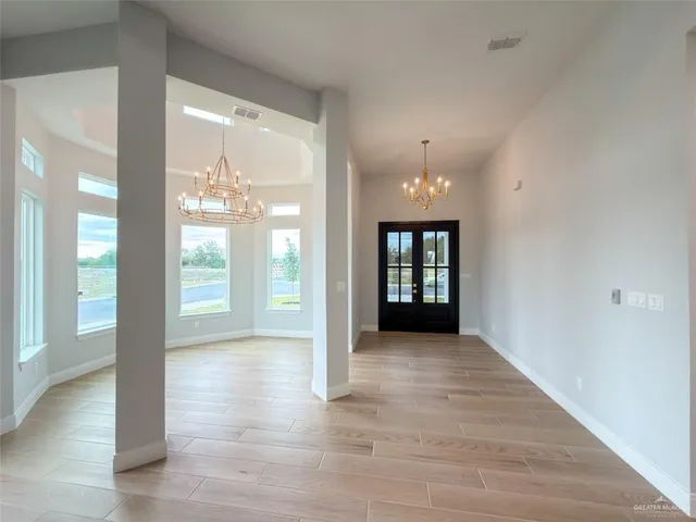 a view of an entryway with a chandelier