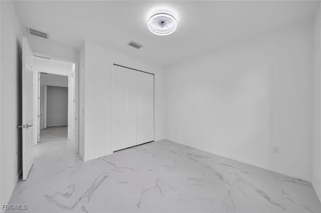 an empty room with a washer and dryer