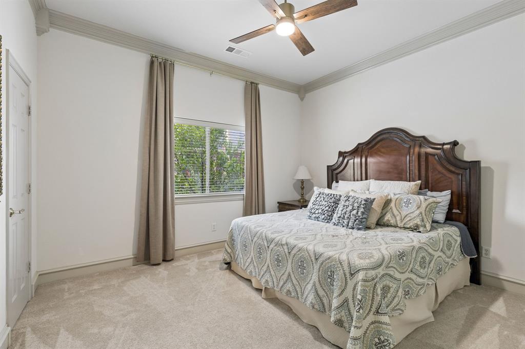 8517 Navigation Drive Rowlett, TX 75088 - Photo 25 of 39 a bedroom with a bed and a window