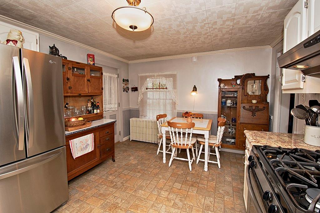 224 Kilgallen Road Butler, PA 16002 - Photo 5 of 25 a kitchen with stainless steel appliances granite countertop a refrigerator and a stove top oven