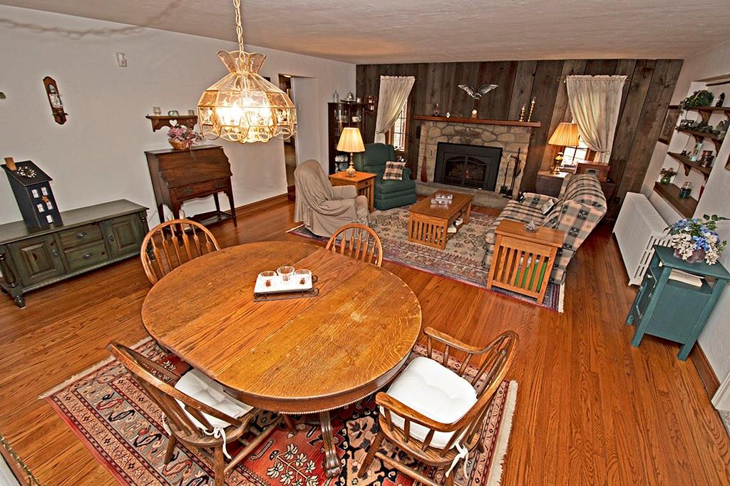 224 Kilgallen Road Butler, PA 16002 - Photo 8 of 25 an outdoor living room with furniture a fireplace and wooden floor