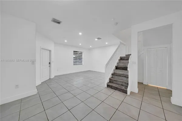 a view of entryway and hall with a window