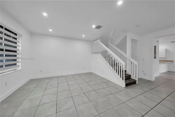 a view of an entryway with stairs
